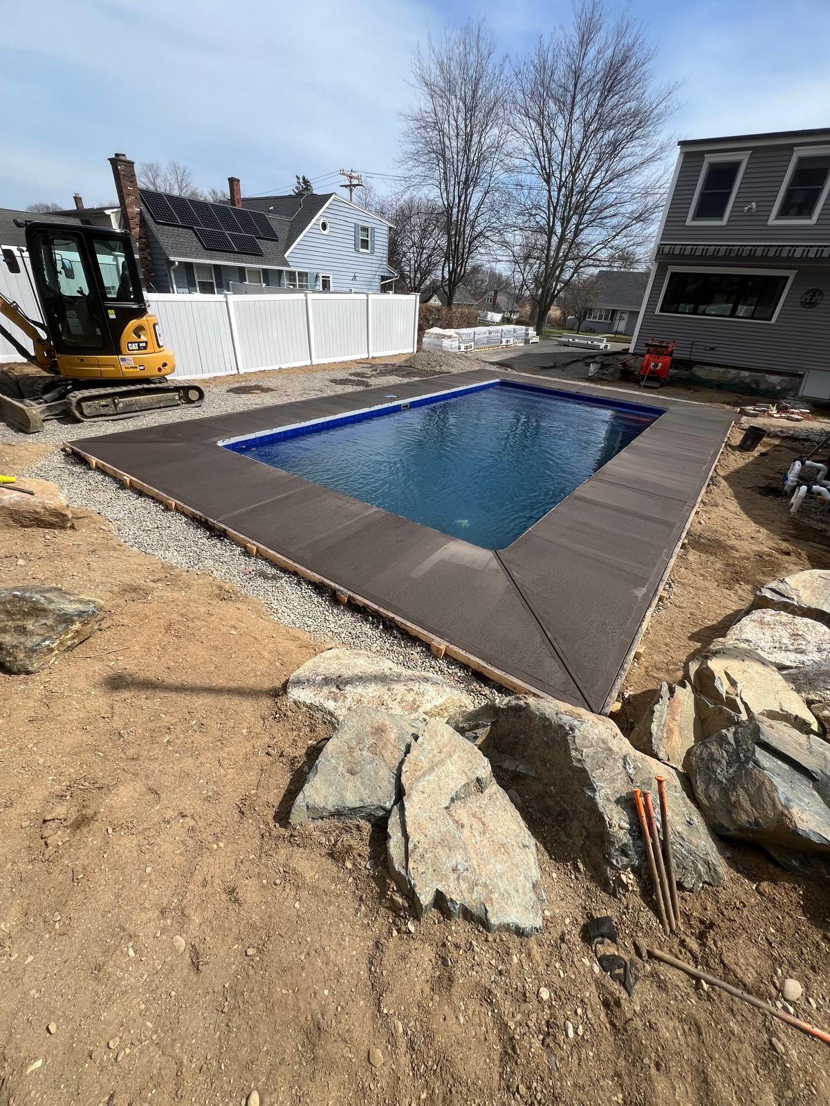 Paver walkway around a residential pool
