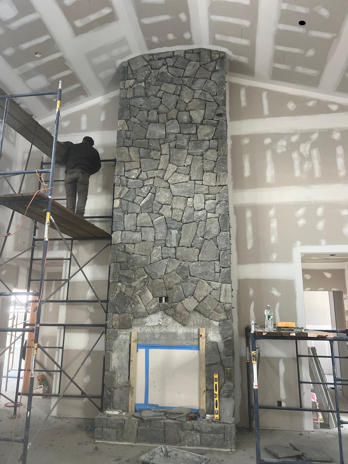 Stone fireplace surround during installation